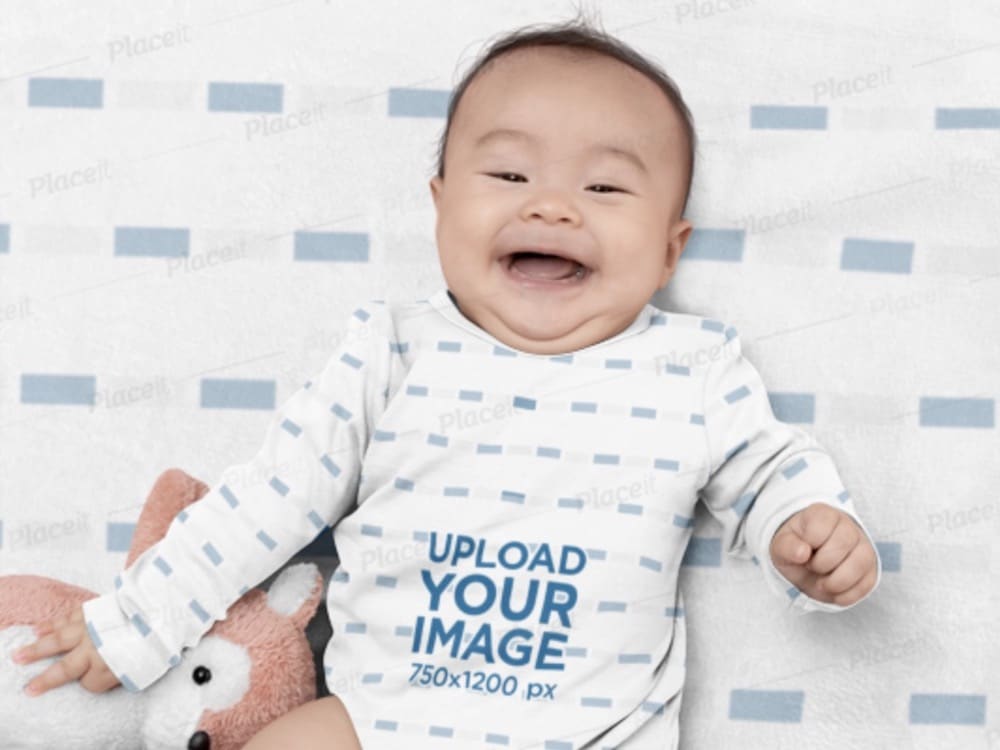 happy baby in onesie on an editable blanket mockup