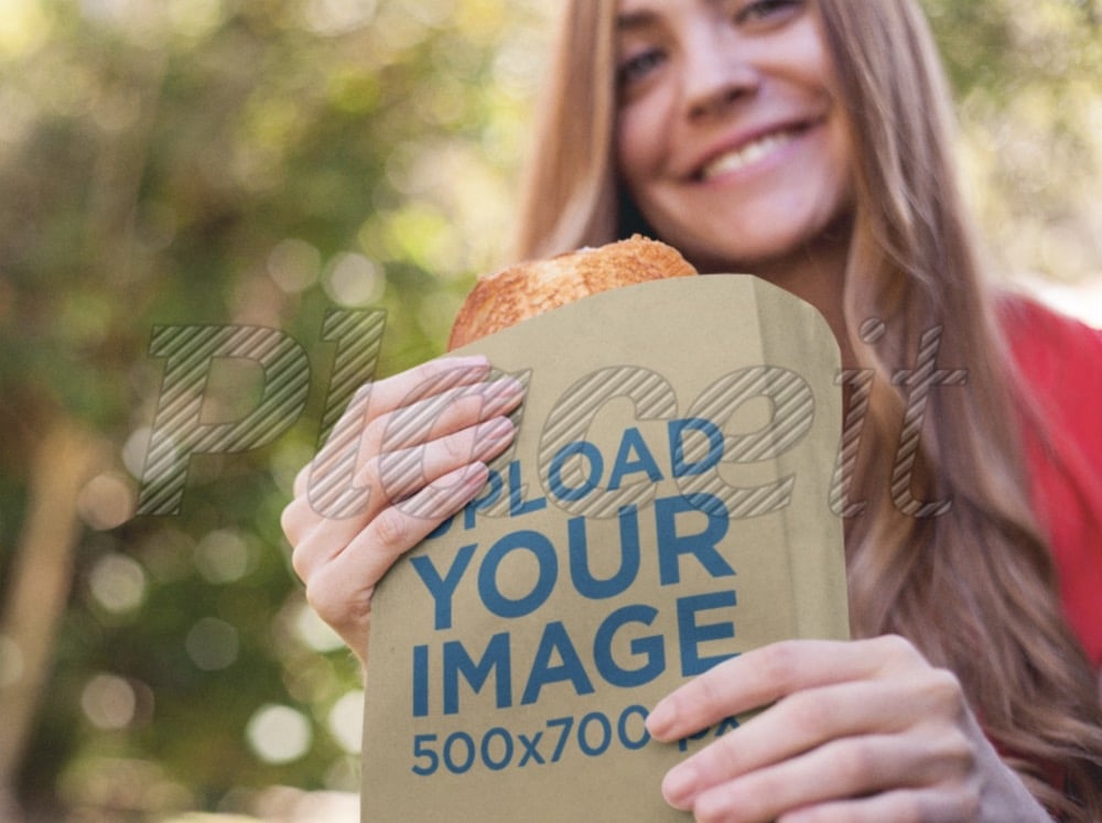 paper bag mockup of a woman eating a sandwich