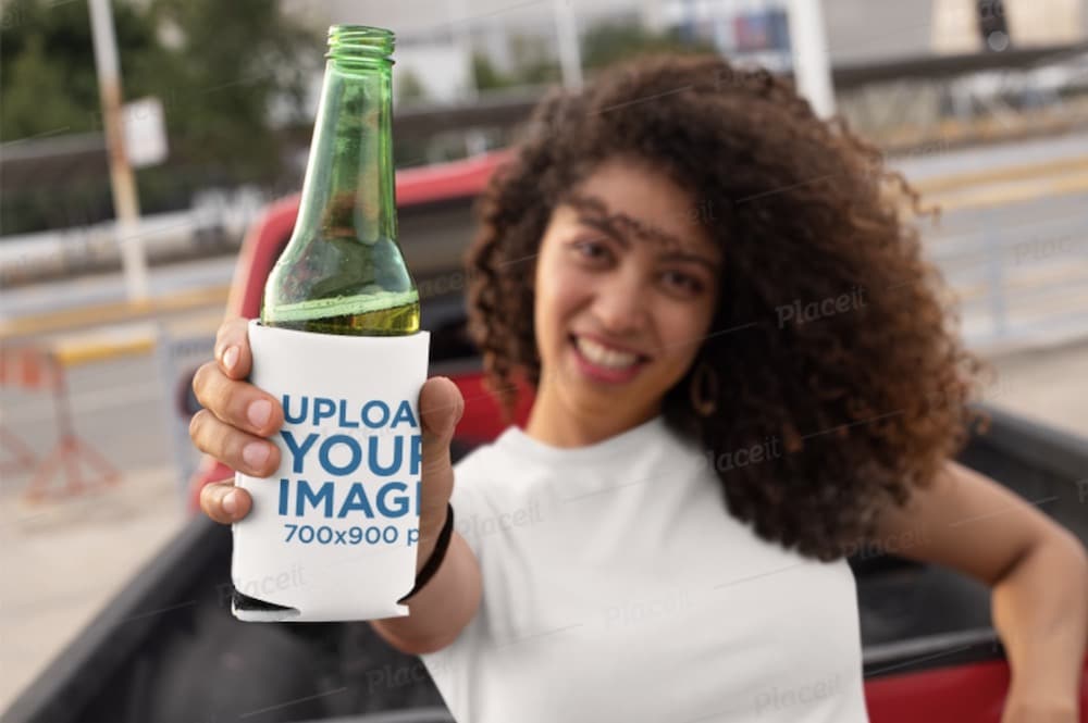 mockup of a woman holding a beer in a koozie