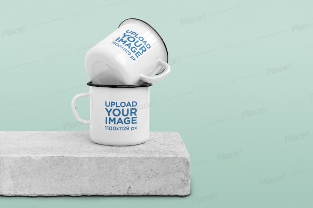 mockup of two enamel mugs on a concrete block