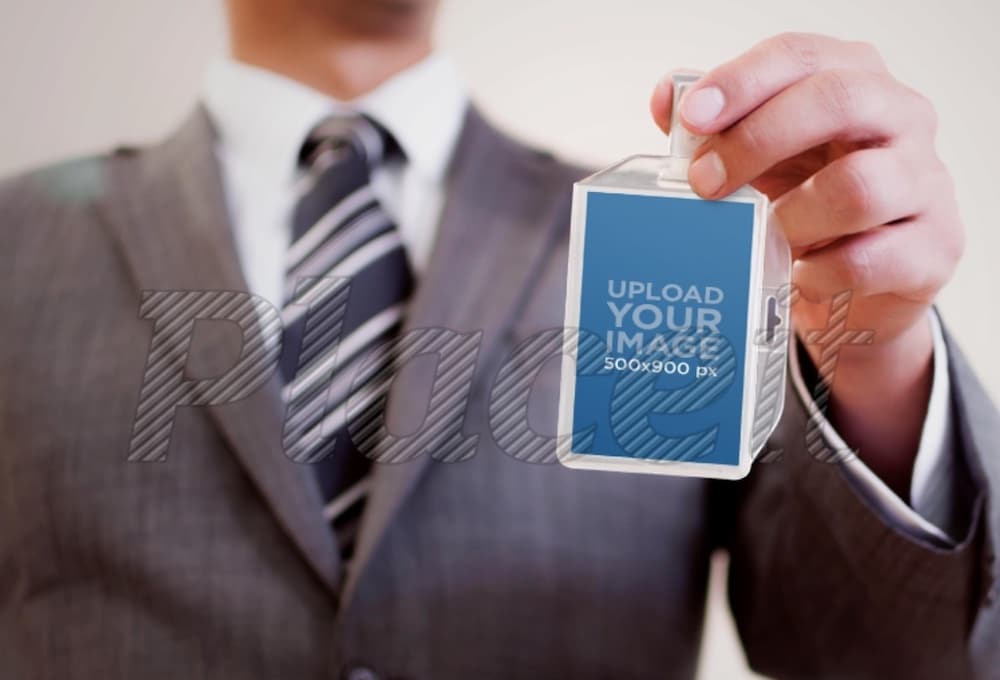 businessman holding his name tag