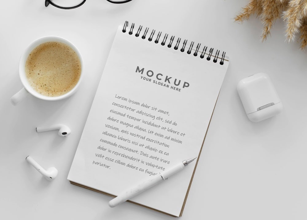 arrangement with notepad on a desk mockup