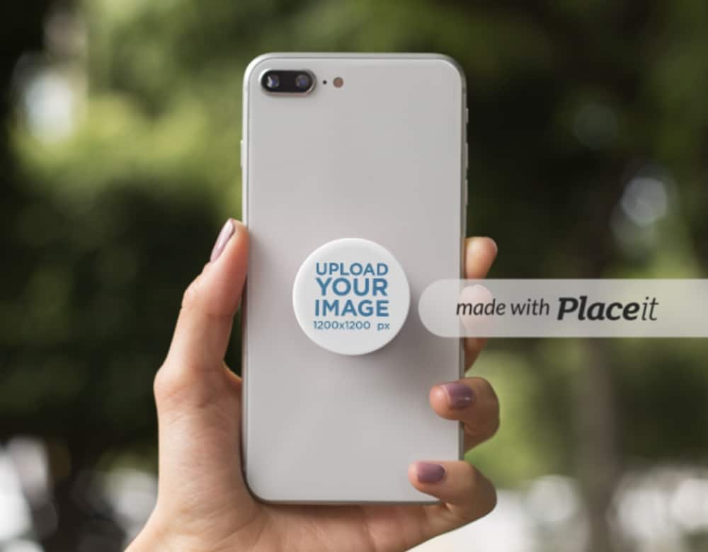 iphone with popsocket in hand mockup