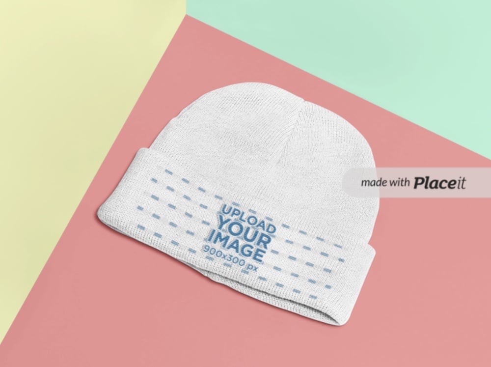 mockup of a beanie lying on a multi colored background