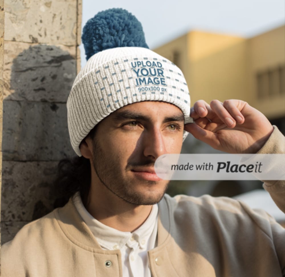 mockup of a man wearing a pom pom beanie