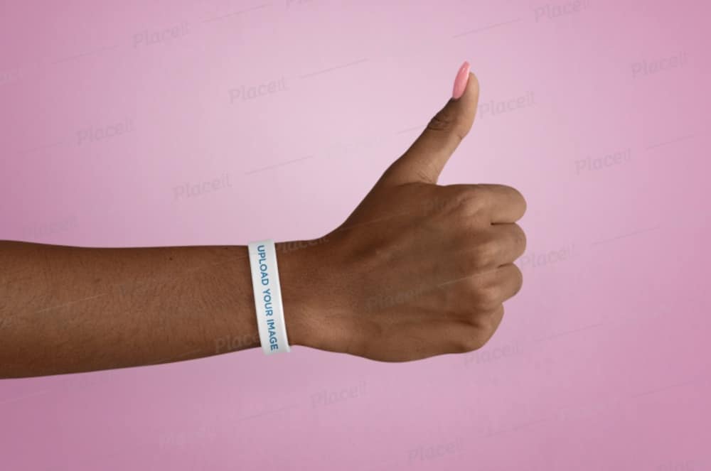 silicone wristband of a woman giving thumbs up