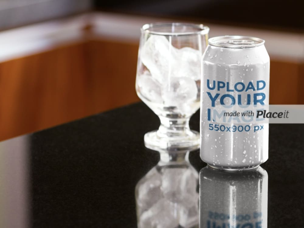 soda can next to a glass with ice mockup