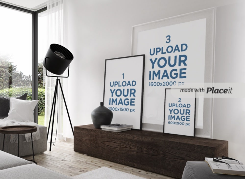 three art prints placed against a modern living room wall mockup