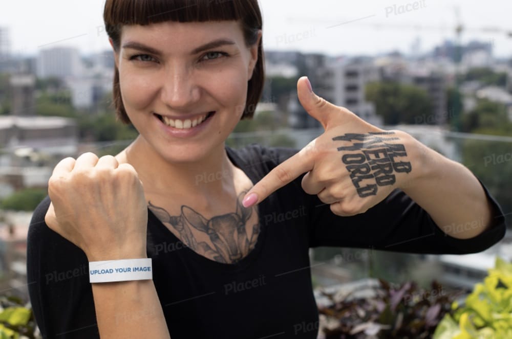 woman showing off her paper wristband